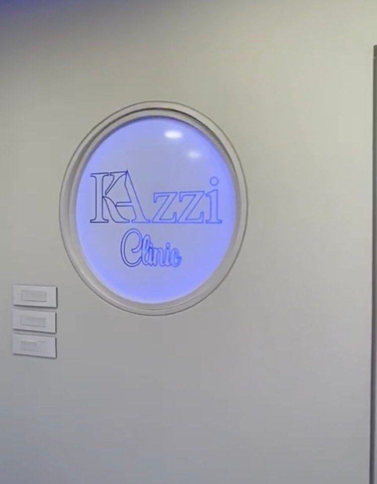 Kazzi Clinic sign at the entrance